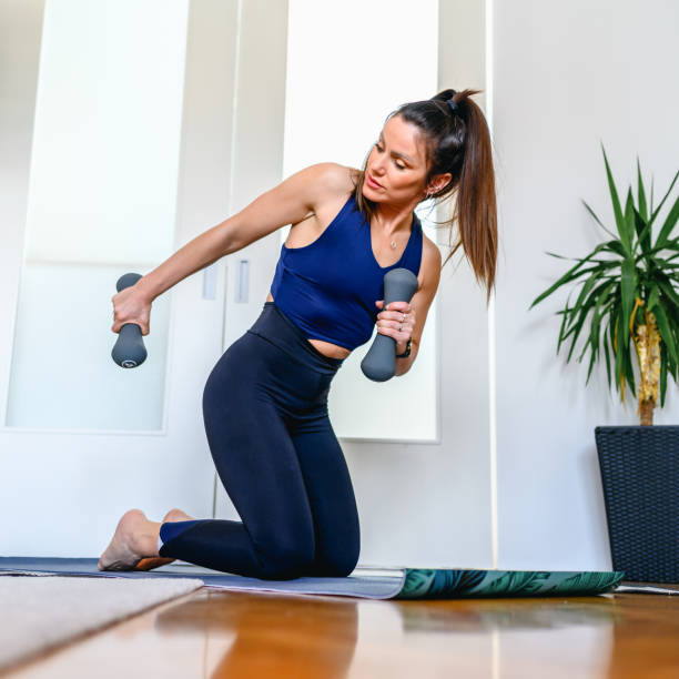 istock Woman exercising at home 1314928407