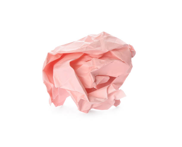 istock Crumpled sheet of light pink paper isolated on white 1314931030