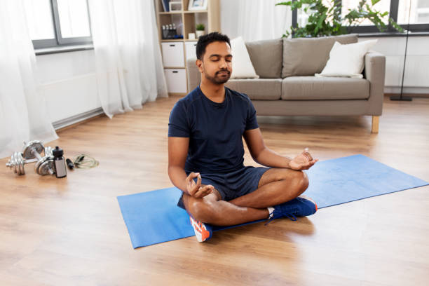istock indian man meditating in lotus pose at home 1314933332