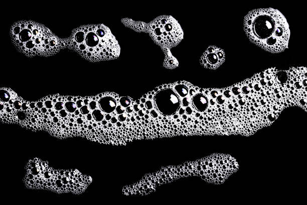 istock Washing foam shape isolated on black. 1314933397