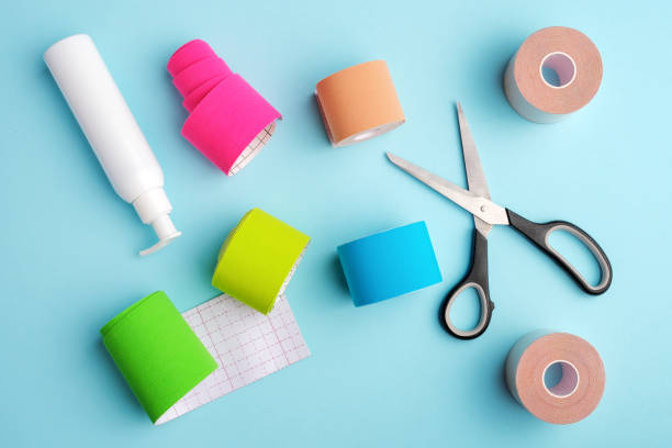 istock kinesiology tape, scissors and antiseptic bottle on blue background 1314933557