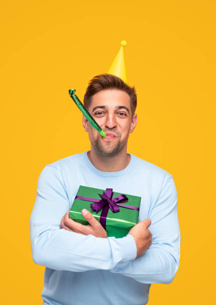 istock Young man in cap celebrating birthday 1314949377