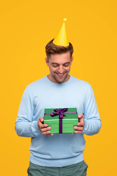 istock Happy man with birthday gift box 1314949379