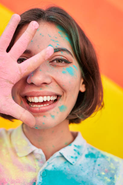 istock Bright woman in dry paints smiling at camera 1314949499