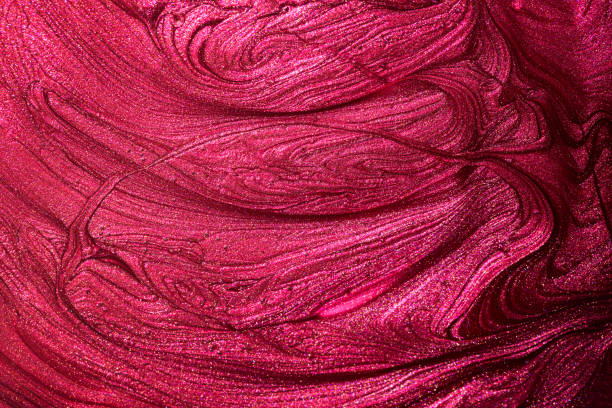 istock Red pink enamel nail polish texture background. Makeup varnish sample abstraction 1314950044