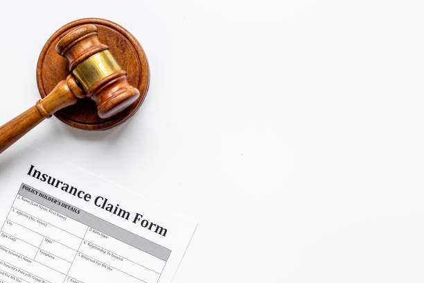 istock Insurance claim form with judge gavel . Top view 1314952096