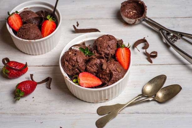 istock Homemade chocolate ice cream with berry fruit in a cup 1314953413