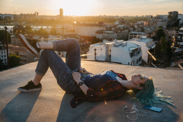istock Woman lying on a rooftop 1314954973