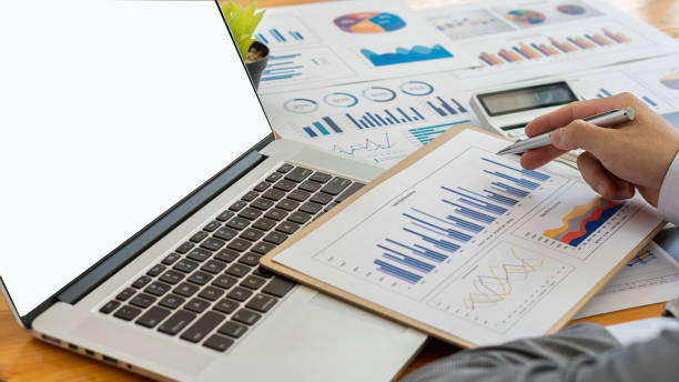 istock Business people doing business in finance and calculating calculators and analyzing graphs about the cost of investing in real estate and other tax systems. 1314956329