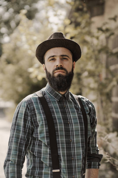istock A handsome young man with a beard poses in the ruins. 1314956465
