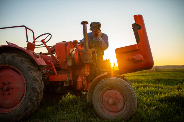 istock Farmer is talking on the phone 1314957321