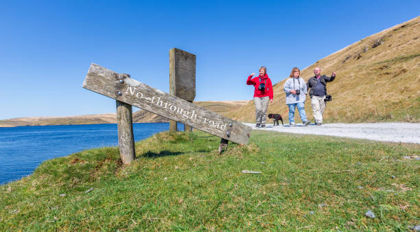 istock Three friends walking on no outlet road 1314959246