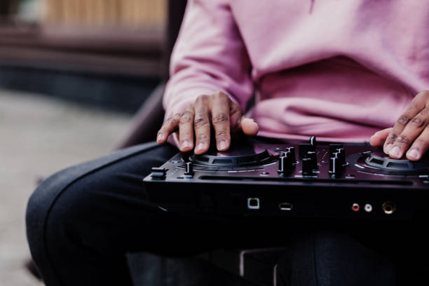 istock Male dj playing music in city 1314970103