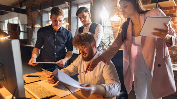 istock Colleagues working together in modern office using devices and gadgets during creative meeting 1314971775