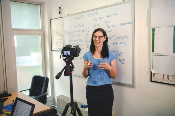 istock Cheerful woman tutor working online. 1314972418