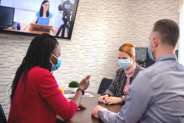 istock Business people having a video call in office. 1314973559
