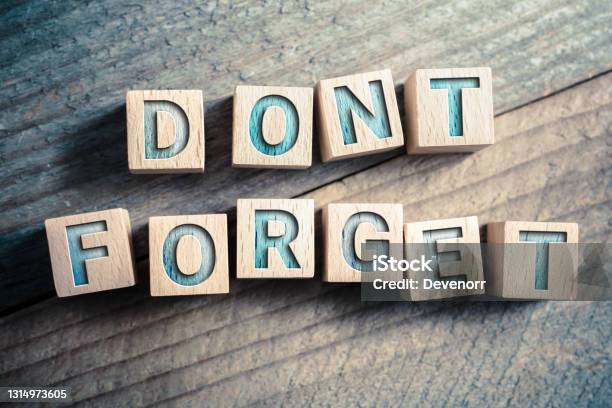 Dont Forget Written On Wooden Blocks On A Board Reminder Concept Stock Photo - Download Image Now