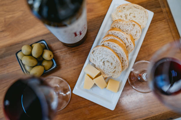 istock Bread, cheese, olives and wine on table 1314974047