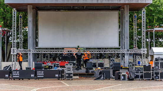 Melbourne, Victoria, Australia, April 17th, 2021: A stage crew is preparing audio and lighting equipment for a musical performance in Carlton