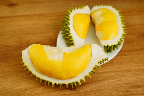 istock Closeup durian fruit peel in half on wooden table background. 1314974850