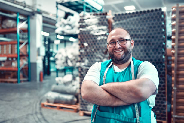 istock Smiling Plump Male Working In Textile Factory Warehouse 1314976917