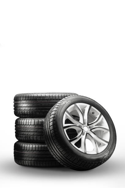 istock summer tires and wheels - stack on a white background, new wheels vertical photo 1314978567