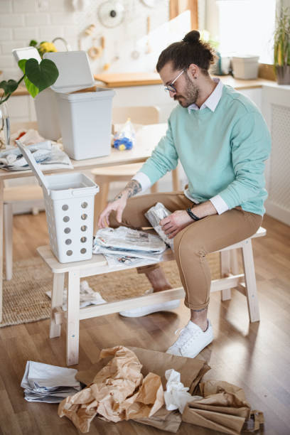 istock Young man recycling trash at home 1314979553