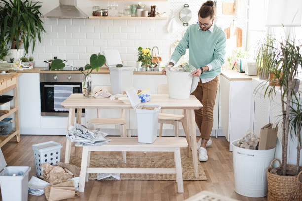 istock Man separates wastes at home for recycling 1314979801