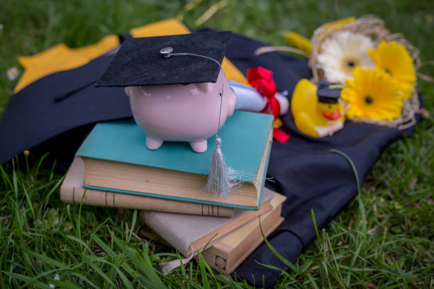istock Tassel hanging from the cap with a rolled up diploma 1314981189