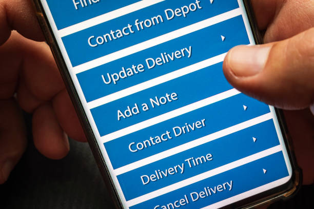 istock Male thumb finger over parcel delivery app on smartphone screen 1314982846