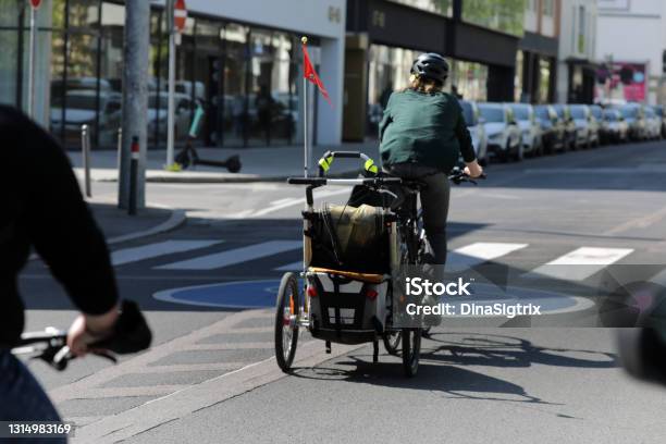 Cyclists With Load Bike Stock Photo - Download Image Now - Cargo Bike, Bicycle, Cycling