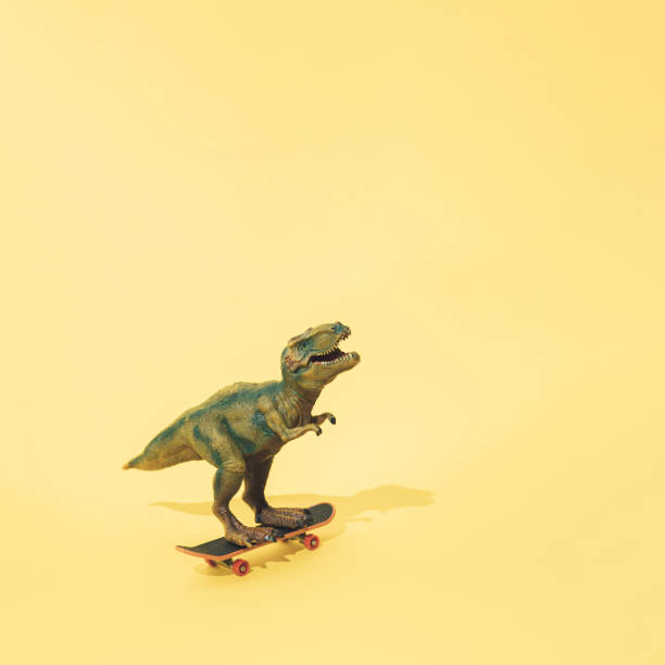 istock Tyrannosaurus rex on a skateboard. Yellow background. Minimal t rex design. 1314988848
