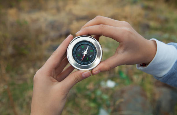 istock Woman hands with magnetic compass in mountains. 1314990164