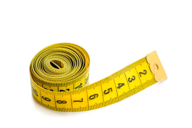 istock Yellow isolated metric measuring tape isolated on white background. Centimeter, close-up 1314992425
