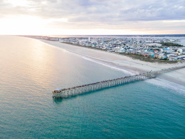 Drone View of Oceanana Pier in Atlantic Beach, North Carolina at Sunset Aerial view of the Oceanana Pier in Atlantic Beach on the Crystal Coast of North Carolina at sunset. outer banks north carolina stock pictures, royalty-free photos & images