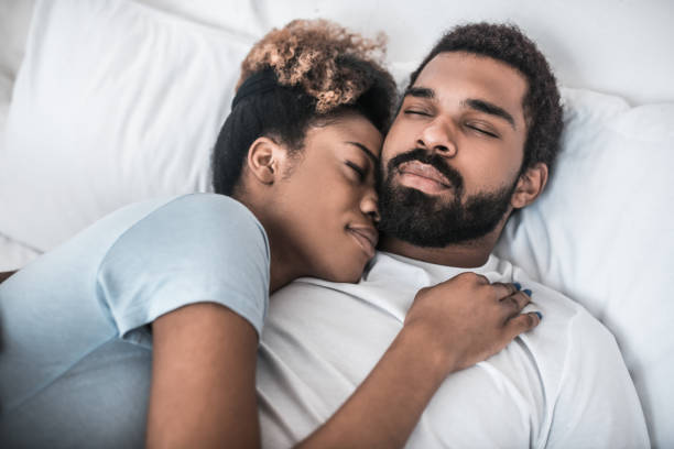 istock Dark-skinned young husband and wife hugging each other. 1314994560