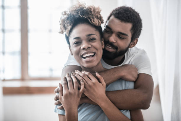 istock Loving man hugging rejoicing laughing woman 1314994632