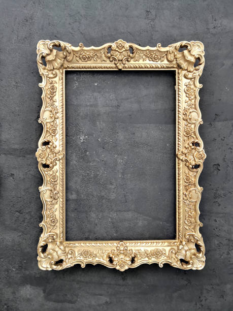 istock Empty golden frame for canvas, on plaster wall painted in black 1314995141