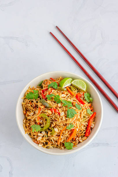 istock Asian Peanuts Noodles with Veggies Vertical Photo 1315001074