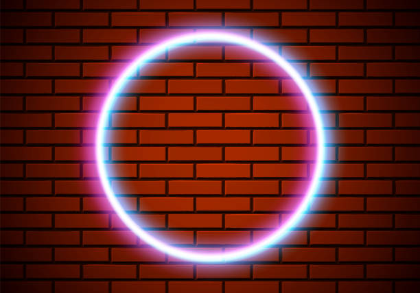 istock Neon frame with circle shape on the red brick wall. Classic round 80s styled shiny glowing neon sign. 1315001630