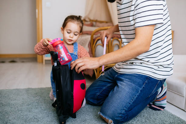 istock Father preparing his child for school at home 1315003190