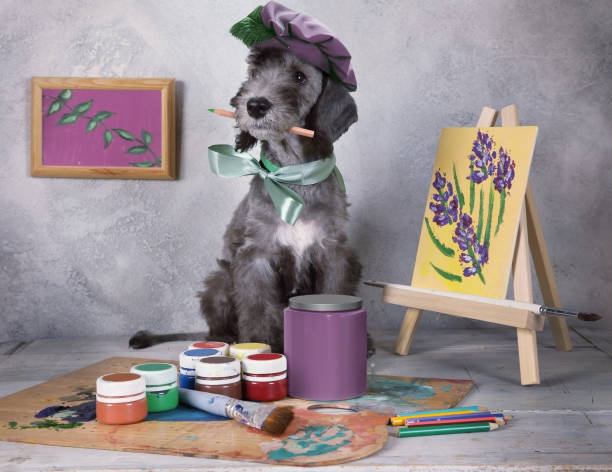 istock Funny artist puppy Bedlington in the workshop 1315003301