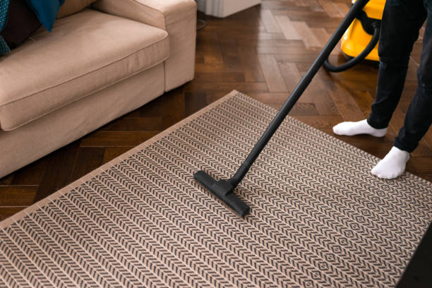 istock Man doing vacuum cleaning in room. 1315004940