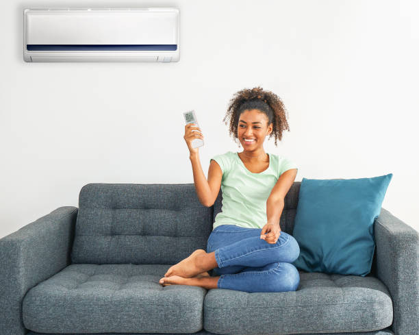 istock Black woman relaxing under the air conditioner 1315009416