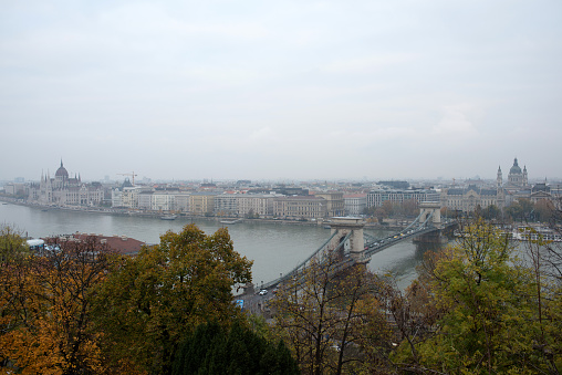Aerial view of Budapest from Royal Palace with river, bridge and parliament house on a cloudy day