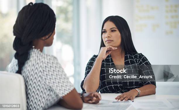 Shot Of A Young Businesswoman Having A Discussion With A Colleague In A Modern Office Stock Photo - Download Image Now