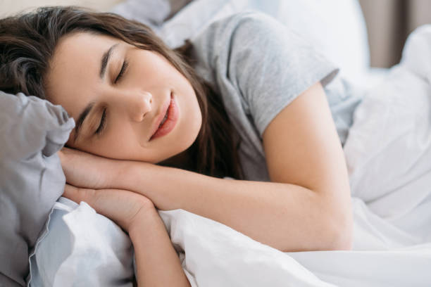 istock morning rest cozy weekend peaceful woman sleeping 1315017158