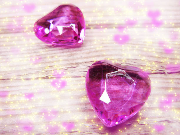 istock crystal gem two ruby hearts love valentine's day on vintage wooden background 1315019323