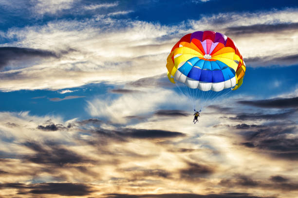 istock Gliding with a parachute on the background of sunset. 1315022615