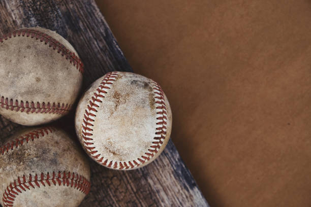 istock Old grunge baseball background with used balls from game and copy space. 1315025004
